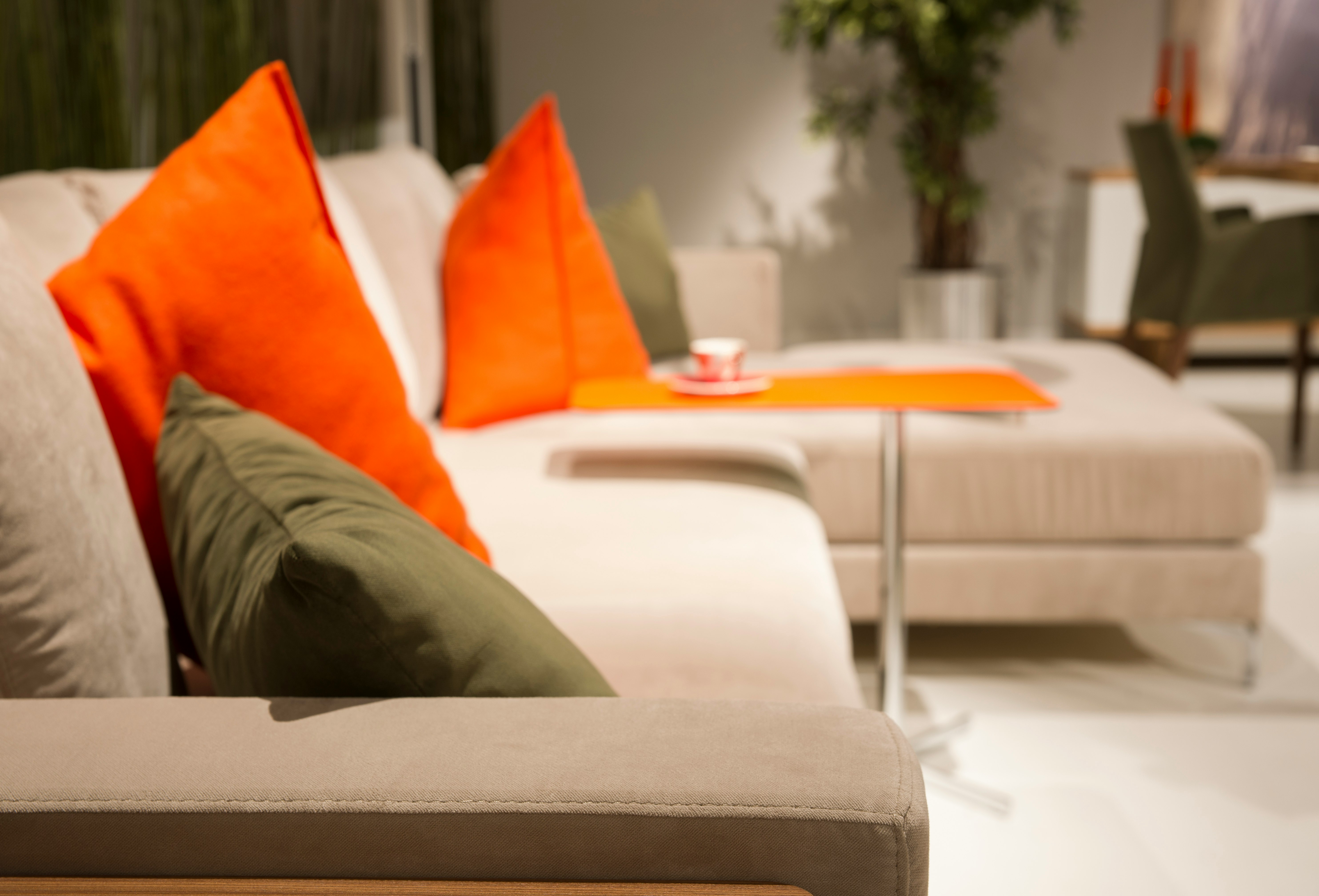 orange throw pillow on white couch